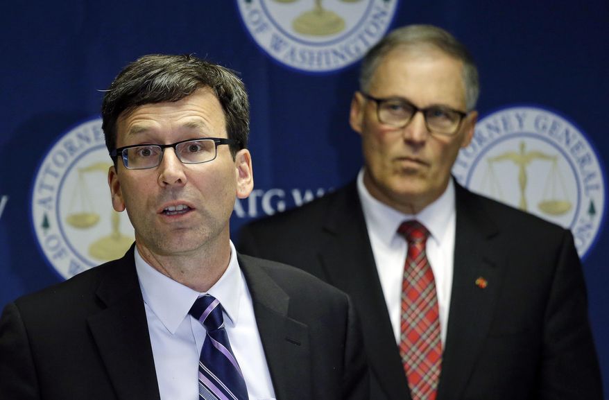 Washington Attorney General Bob Ferguson, left, speaks as Gov. Jay Inslee looks on during a news conference, Thursday, Dec. 8, 2016, in Seattle, where Ferguson announced a lawsuit against agrochemical giant Monsanto over pollution from PCBs, Washington says it&#39;s the first U.S. state to sue Monsanto over pollution from PCBs. The chemicals, polychlorinated biphenyls, were used in many industrial and commercial applications, including in paint, coolants, sealants and hydraulic fluids. PCB contamination impairs rivers, lakes and bays around the country. (AP Photo/Elaine Thompson)