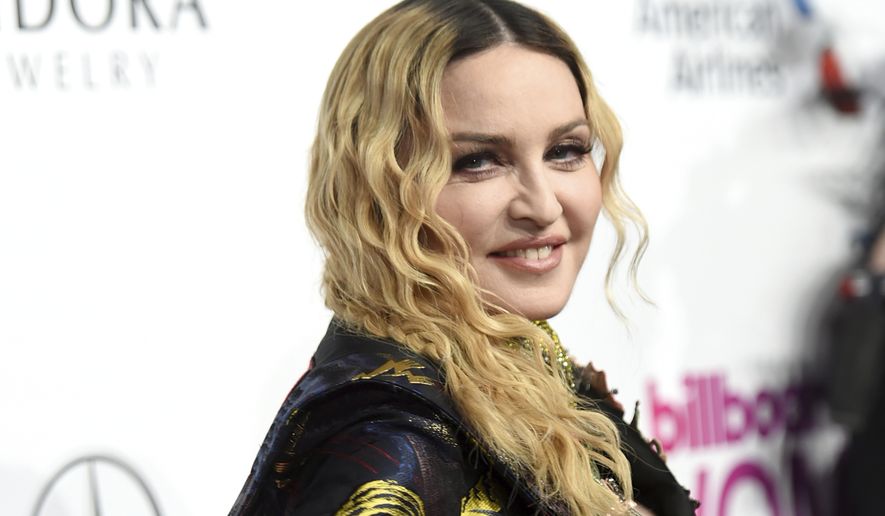 Madonna attends the 11th annual Billboard Women in Music honors at Pier 36 on Friday, Dec. 9, 2016, in New York. Billboard Women in Music 2016 will air Dec. 12 on Lifetime. (Photo by Evan Agostini/Invision/AP)