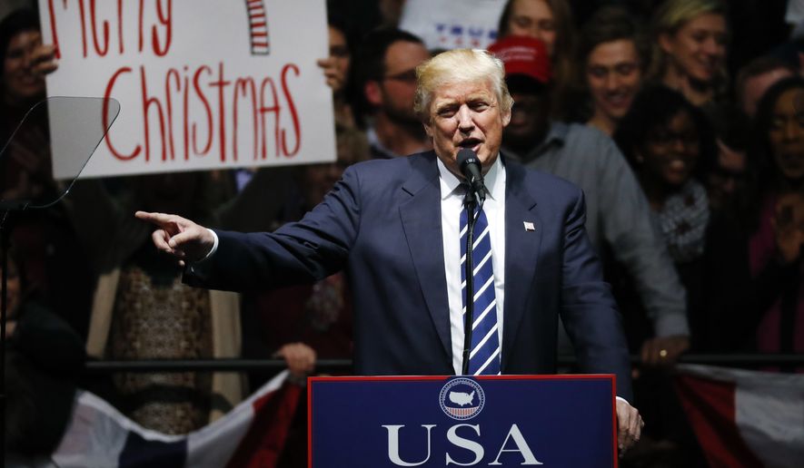 President-elect Donald Trump speaks to supporters about saying Merry Christmas during a rally, in Grand Rapids, Mich., Friday, Dec. 9, 2016. (AP Photo/Paul Sancya)