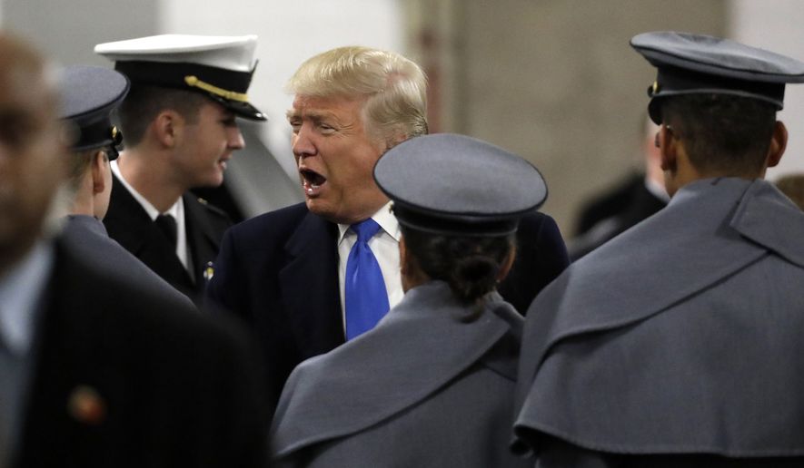 President-elect Donald Trump greets Army Cadets and Navy Midshipmen before the Army-Navy NCAA college football game in Baltimore, Saturday, Dec. 10, 2016. (AP Photo/Patrick Semansky)