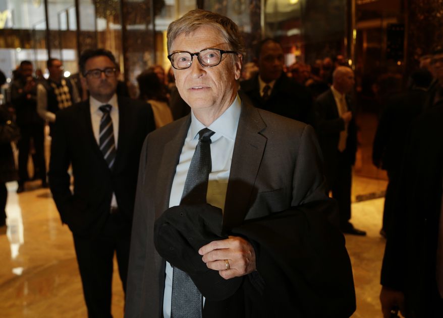 Bill Gates talks to reporters in the lobby of Trump Tower in New York, Tuesday, Dec. 13, 2016. (AP Photo/Seth Wenig)