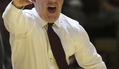Virginia Tech head coach Buzz Williams signals and yells from the bench in the second half of an NCAA college basketball game against Mississippi in Blacksburg, Va., Sunday, Dec. 11, 2016. Virginia Tech won, 80-75. (Matt Gentry/The Roanoke Times via AP)