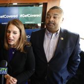 U.S. Department of Health and Human Services Secretary Sylvia Burwell, center, stands with U.S. Sen. Cory Booker, D-N.J., left, and U.S. Rep. Donald Payne, Jr., D-N.J., while talking to reporters during a visit to Tops Diner to talk about the Affordable Care Act, Wednesday, Dec. 14, 2016, in East Newark, N.J. Rep. Payne Jr. died Wednesday after suffering a heart attack earlier in the month. (AP Photo/Julio Cortez)