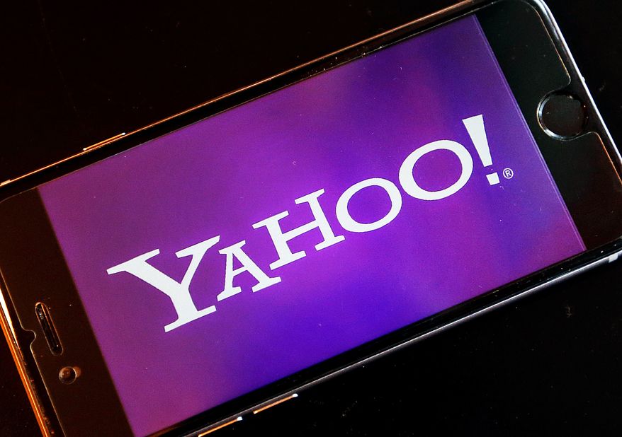 The logo of YAHOO appears on a smartphone in Frankfurt, Germany, Thursday, Dec. 15, 2016. On Wednesday, Dec. 14, 2016, Yahoo said it believes hackers stole data from more than one billion user accounts in August 2013. (AP Photo/Michael Probst)