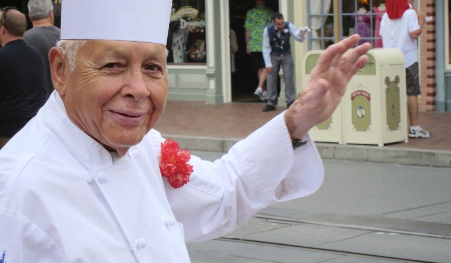 FILE - In this Sept. 20, 2013, file photo, Oscar Martinez greets diners at the Carnation Cafe at Disneyland in Anaheim, Calif. KABC-TV reported Dec. 14, 2016, that Martinez is set to celebrate his 60th anniversary at the park. Disney is the parent company of KABC. (AP Photo/Matt Sedensky, File)