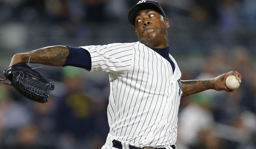 FILE - In a Monday, May 9, 2016 file photo, New York Yankees relief pitcher Aroldis Chapman delivers in the ninth inning of a baseball game against the Kansas City Royals at Yankee Stadium in New York. Hard-throwing reliever Aroldis Chapman completed his return to New York when the Yankees finalized his $86 million, five-year contract on Thursday, Dec. 15, 2016.  (AP Photo/Kathy Willens, File)