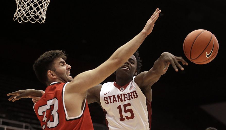 Cal State East Bay guard Drew Bender, left, blocks a shot by Stanford's Marcus Allen (15) during the first half of an NCAA college basketball game Friday, Dec. 16, 2016, in Stanford, Calif. (AP Photo/Ben Margot)