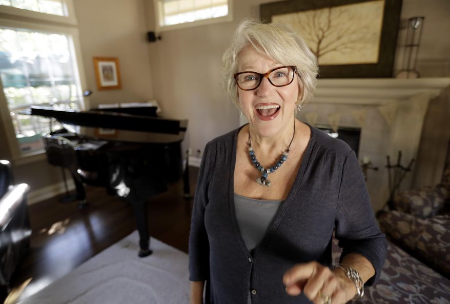 Gayla Peevey, singer of that enduring Christmas classic, "I Want a Hippopotamus For Christmas," sings in her home Wednesday, Dec. 14, 2016, in La Mesa, Calif. It was 1953, and one of the hottest songs on the radio was “I Want a Hippopotamus For Christmas.” Now it’s Christmas 2016, and Peevey is still singing. She leaves that to schoolchildren, ringtones, iTunes downloads and TV commercials that, to the 73-year-old singer’s amazement, keep the song in everyone’s head every Christmas season, whether they want it there or not .(AP Photo/Gregory Bull)