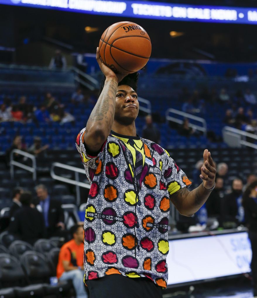 Orlando Magic guard Elfrid Payton (4) drives to the hoop wearing a colorful shirt In honor of Craig Sager before an NBA basketball game against the Brooklyn Nets in Orlando, Fla., on Friday, Dec. 16, 2016. (AP Photo/Reinhold Matay)
