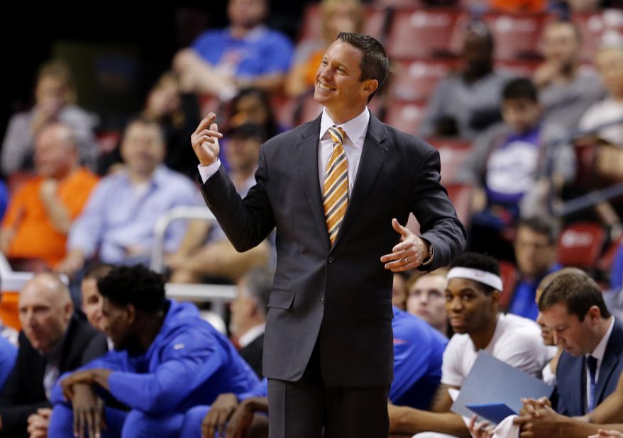 Florida head coach Mike White reacts in the second half of his team&#x27;s win over Charlotte in an NCAA college basketball game in the Orange Bowl Classic tournament, Saturday, Dec. 17, 2016, in Sunrise, Fla. (AP Photo/Joe Skipper)
