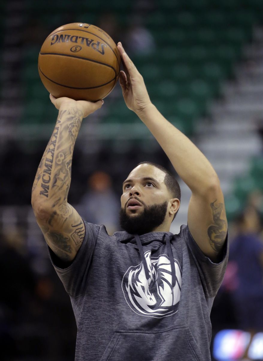 Dallas Mavericks guard Deron Williams (8) shoots during practice before an NBA basketball game against the Utah Jazz, Friday, Dec. 16, 2016, in Salt Lake City. (AP Photo/Rick Bowmer)