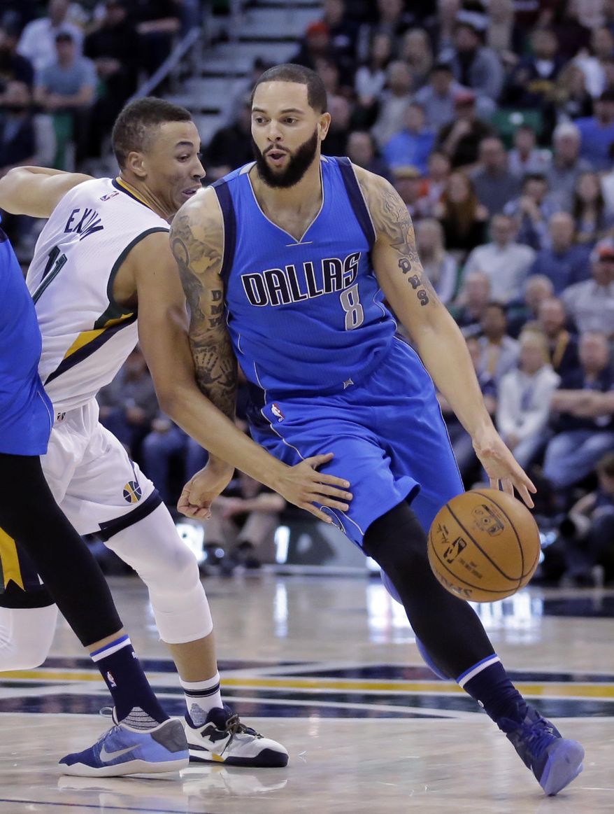 Dallas Mavericks guard Deron Williams (8) drives around Utah Jazz guard Dante Exum (11) in the first half during an NBA basketball game Friday, Dec. 16, 2016, in Salt Lake City. (AP Photo/Rick Bowmer)