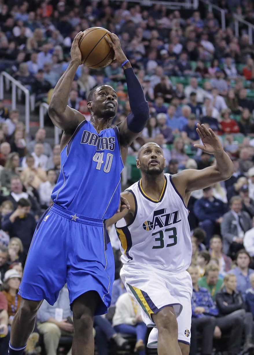 Dallas Mavericks forward Harrison Barnes (40) goes to the basket as Utah Jazz center Boris Diaw (33) defends in the first half during an NBA basketball game Friday, Dec. 16, 2016, in Salt Lake City. (AP Photo/Rick Bowmer)