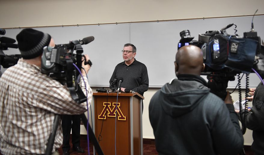 University of Minnesota President Eric Kaler speaks to members of the media Saturday, Dec. 17, 2016, after players announced the end of their boycott of the Holiday Bowl in Minneapolis. The team will play in the Holiday Bowl, reversing a threat to boycott the game because of the suspension of 10 players accused of sexual assault. (Aaron Lavinsky/Star Tribune via AP)