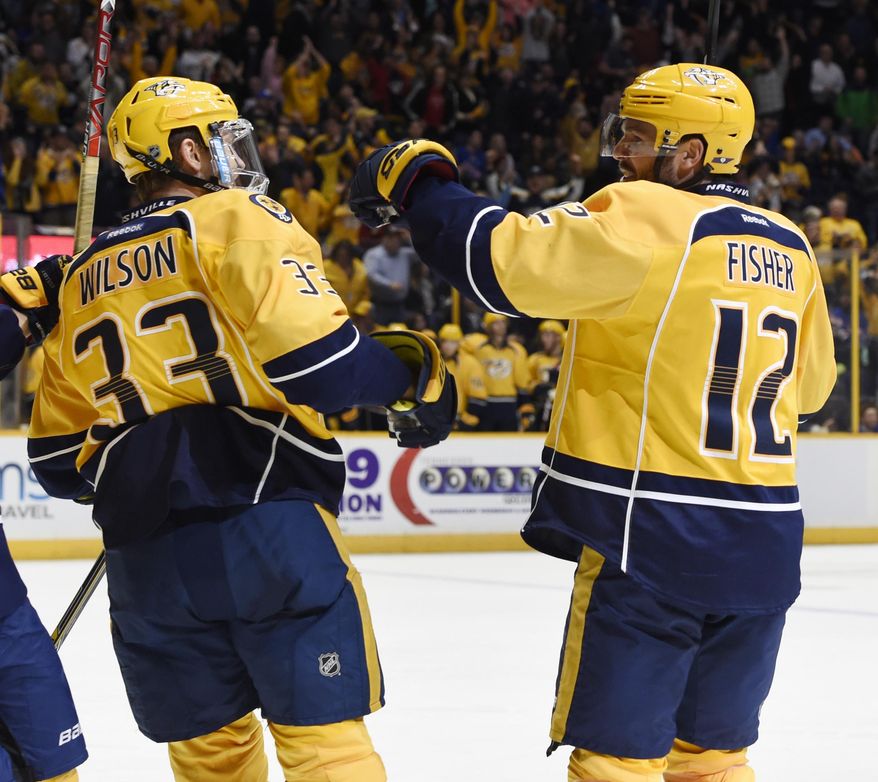 Nashville Predators&#39; Mike Fisher  celebrates his goal with teammate Colin Wilson (33) during the second period of an NHL hockey game against the New York Rangers, Saturday, Dec. 17, 2016, in Nashville, Tenn. (AP Photo/Sanford Myers)