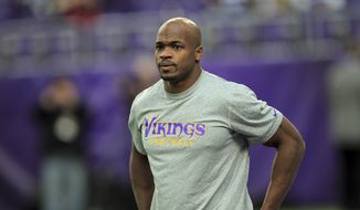 Minnesota Vikings running back Adrian Peterson warms up before the start of an NFL football game between the Indianapolis Colts and the Minnesota Vikings Sunday, Dec. 18, 2016, in Minneapolis. (AP Photo/Andy Clayton-King)