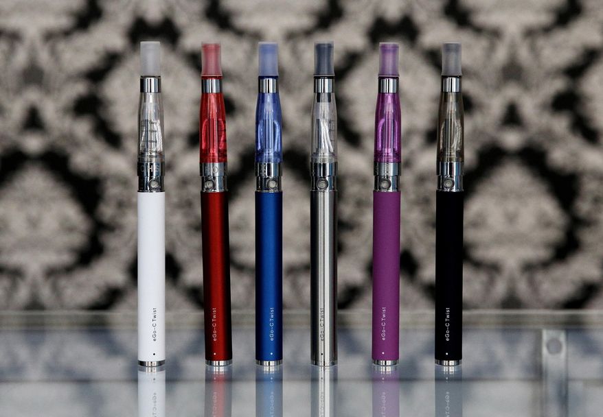 In this April 23, 2014, file photo, e-cigarettes appear on display at Vape store in Chicago. (AP Photo/Nam Y. Huh, File)