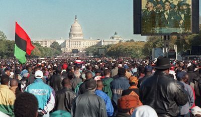FILE - In this Oct. 16, 1995 file photo, a video screen shows Nation of Islam leader Louis Farrakhan speaking during the Million Man March at the Mall in Washington. The Capitol is seen in the background. Two decades later, the march Farrakhan organized, which drew hundreds of thousands to Washington, remains a cultural touchstone. (AP Photo/Steve Helber)