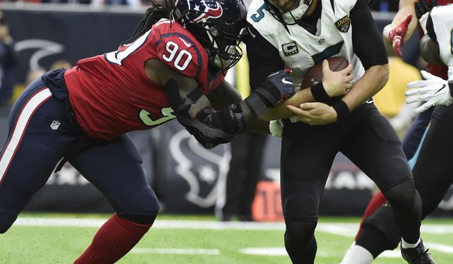 Jacksonville Jaguars quarterback Blake Bortles (5) is sacked by Houston Texans defensive end Jadeveon Clowney (90) during the first half of an NFL football game Sunday, Dec. 18, 2016, in Houston. (AP Photo/Eric Christian Smith)