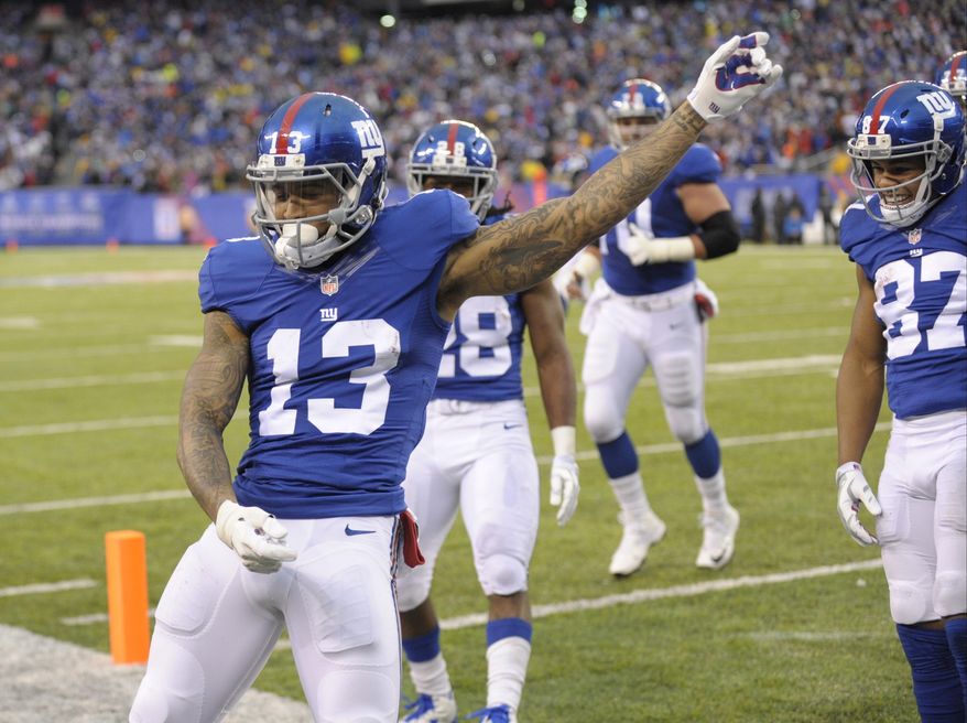 New York Giants wide receiver Odell Beckham (13) celebrates after scoring a touchdown during the second half of an NFL football game against the Detroit Lions Sunday, Dec. 18, 2016, in East Rutherford, N.J. (AP Photo/Bill Kostroun)