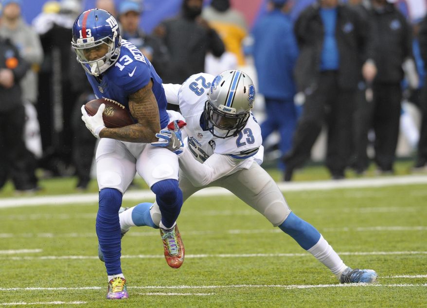 Detroit Lions cornerback Darius Slay (23) tackles New York Giants&#39; Odell Beckham (13) during the first half of an NFL football game Sunday, Dec. 18, 2016, in East Rutherford, N.J. (AP Photo/Bill Kostroun)