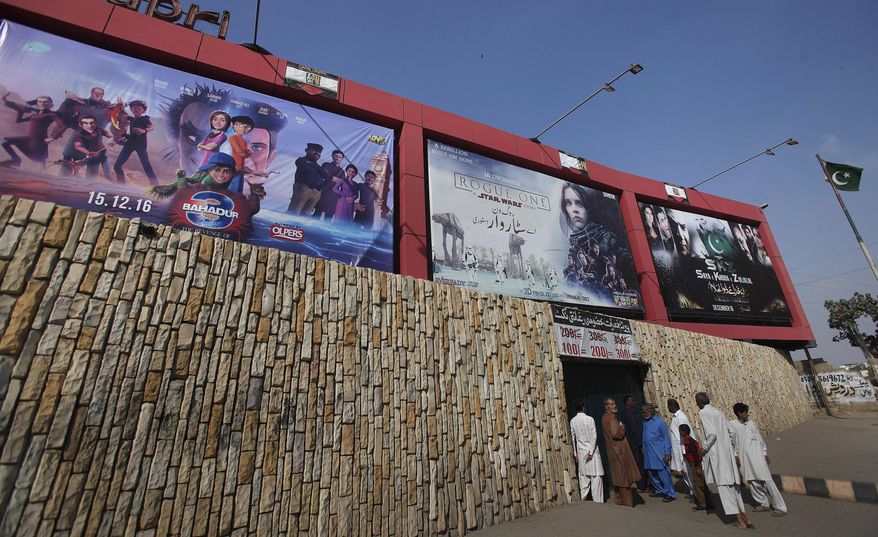 Billboards of a local cinema display films in Karachi, Pakistan, Sunday, Dec. 18, 2016. A Pakistan Film Exhibitors Association official says local cinema owners have decided to resume screening of Indian movies after a two month self-imposed ban. (AP Photo/Fareed Khan)