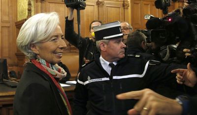 In this Monday, Dec. 12, 2016 file picture, International Monetary Fund chief Christine Lagarde, right, arrives at the special Paris court, France. French court finds IMF chief Christine Lagarde guilty in arbitration case, but she escapes punishment. (AP Photo/Thibault Camus, File)