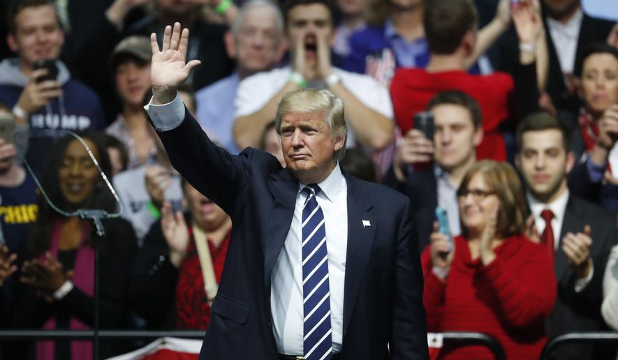 In this Friday, Dec. 9, 2016, file photo, President-elect Donald Trump waves to supporters during a rally in Grand Rapids, Mich. (AP Photo/Paul Sancya, File)