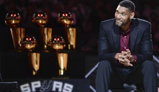 San Antonio Spurs&#39; Tim Duncan listens while special guests speak about him during his jersey retirement ceremony, Sunday, Dec. 18, 2016, in San Antonio. (AP Photo/Darren Abate)
