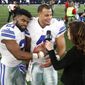 Dallas Cowboys&#39; Ezekiel Elliott (21) leans his head on quarterback Dak Prescott (4) as the duo give a post game interview to Michele Tafoya, right, following their 26-20 win in an NFL football game against the Tampa Bay Buccaneers on Sunday, Dec. 18, 2016, in Arlington, Texas. (AP Photo/Michael Ainsworth)