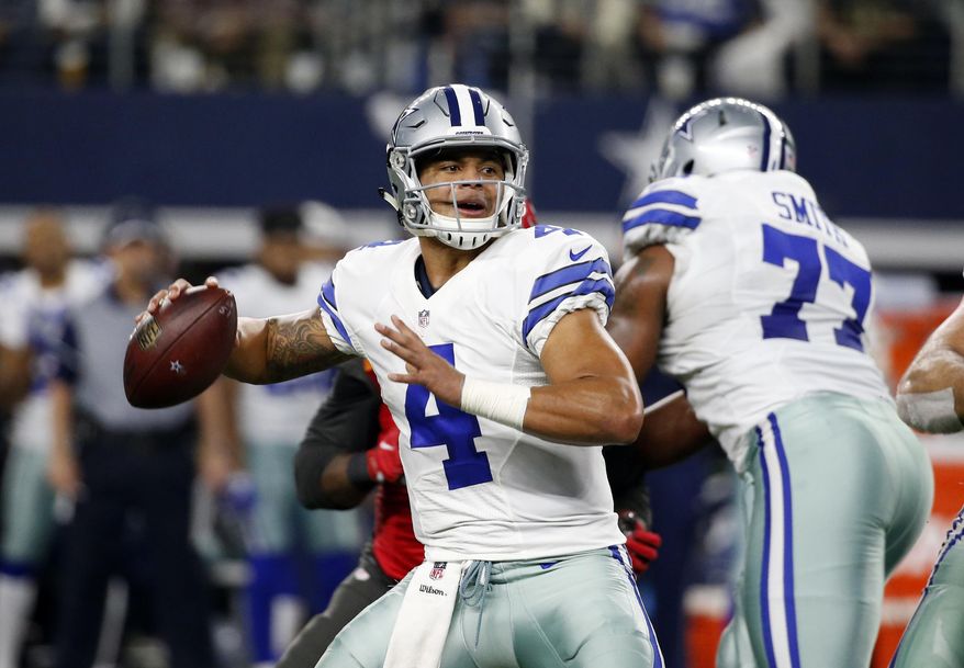 Dallas Cowboys quarterback Dak Prescott (4) prepares to throw a pass as Tyron Smith (77) provides protection in the first half of an NFL football game against the Tampa Bay Buccaneers on Sunday, Dec. 18, 2016, in Arlington, Texas. (AP Photo/Michael Ainsworth)