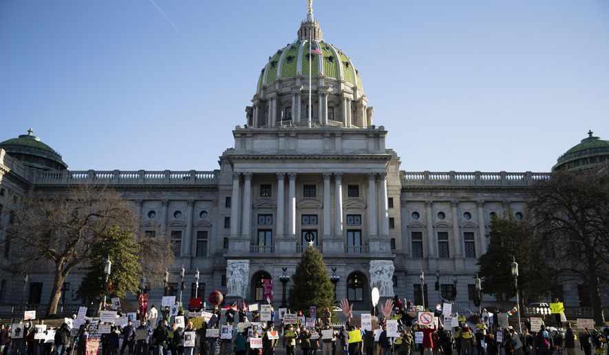 Protesters demonstrate ahead of Pennsylvania&#39;s 58th Electoral College at the state Capitol in Harrisburg, Pa., Monday, Dec. 19, 2016. The demonstrators were waving signs and chanting in freezing temperatures Monday morning as delegates began arriving at the state Capitol to cast the state&#39;s electoral votes for president. (AP Photo/Matt Rourke)