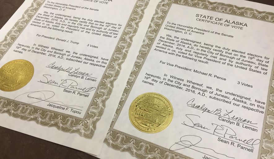 Paperwork signed by Alaska's three Republican electors as part of the electoral college is displayed Monday, Dec. 19, 2016, in Juneau, Alaska. Republican President-elect Donald Trump defeated Democrat Hillary Clinton in Alaska in the November general election. (AP Photo/Becky Bohrer)