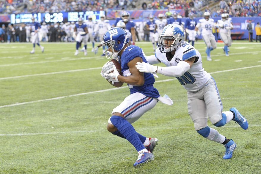 Detroit Lions defensive back Asa Jackson (30) tackles New York Giants&#39; Sterling Shepard (87) after he catches a pass for a touchdown during the first half of an NFL football game Sunday, Dec. 18, 2016, in East Rutherford, N.J. (AP Photo/Bill Kostroun)