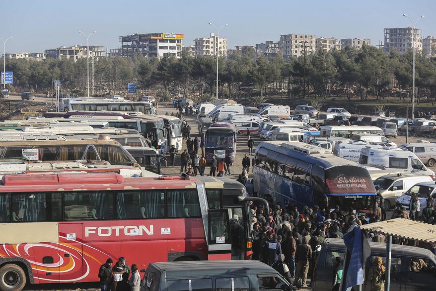 Syrians evacuated from the embattled Syrian city of Aleppo during the ceasefire arrive at a refugee camp in Rashidin, near Idlib, Syria, Tuesday, Dec. 20, 2016. Russian Foreign Minister Sergey Lavrov said on Tuesday that Russia, Iran and Turkey are ready to act as guarantors in a peace deal between the Syrian government and the opposition. He spoke on Tuesday after a meeting of the three countries' foreign ministers in Moscow. (AP Photo)