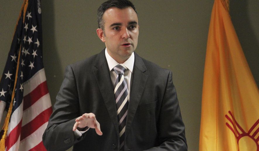 Bernalillo County District Attorney-elect Raul Torrez unveils plans in Albuquerque, N.M., Tuesday, Dec. 20, 2016 for an independent review of the case involving two former Albuquerque police officers accused in the shooting death of a mentally ill homeless man in a 2014 standoff. Torrez said the review will be done by an independent team of prosecutors from around the state and a recommendation is expected early next year. (AP Photo/Susan Montoya Bryan)