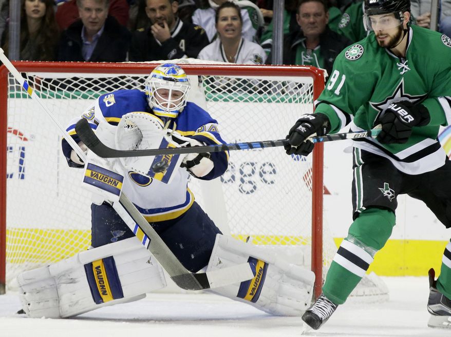 St. Louis Blues goalie Jake Allen (34) defends the goal against Dallas Stars center Tyler Seguin (91) during the first period of an NHL hockey game in Dallas, Tuesday, Dec. 20, 2016. (AP Photo/LM Otero)