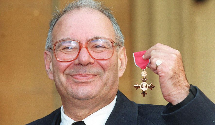 FILE - This is a Nov. 1, 1994 file photo of Rabbi Lionel Blue after receiving his OBE at Bucking Palace, London. British rabbi Lionel Blue, who was known for his popular early morning radio spots, has died. He was 86. Blue was the first openly gay rabbi in Britain. The Liberal Judaism group said he died Monday Dec. 19, 2016. (PA, File via AP)