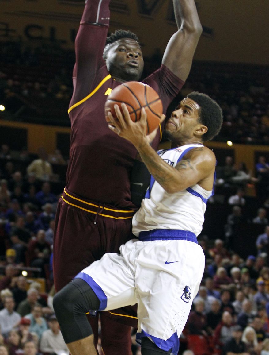 Creighton guard Maurice Watson Jr., right, collides with Arizona State&#x27;s Jethro Tshisumpa as he drives to the basket during the first half of an NCAA college basketball game, Tuesday, Dec. 20, 2016, in Tempe, Ariz. (AP Photo/Ralph Freso)