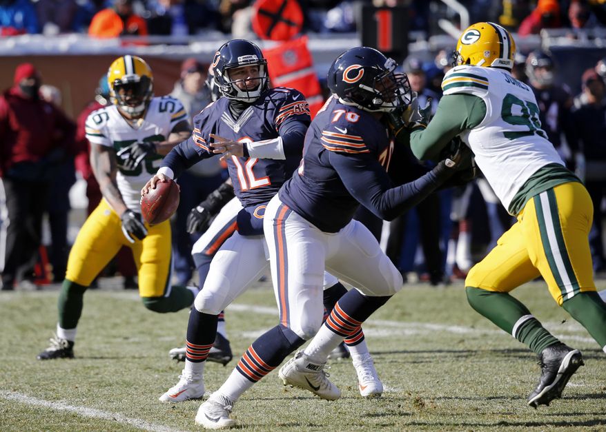 Chicago Bears quarterback Matt Barkley (12) throws a pass during the first half of an NFL football game against the Green Bay Packers, Sunday, Dec. 18, 2016, in Chicago. (AP Photo/Charles Rex Arbogast)
