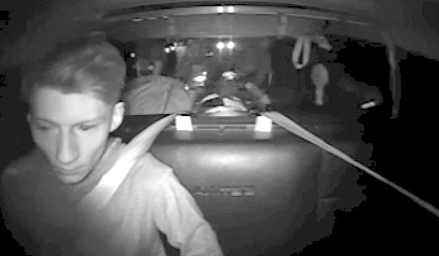 FILE - This July 30, 2016, file image made from a video provided by Washington State Patrol via The Daily Herald shows Allen Ivanov in the back of a patrol car in a police camera video shortly after his arrest on Interstate 5 in Lewis County, Wash. Ivanov, who shot and killed three people at a house party in July near Seattle, pleaded guilty Monday, Dec. 19, one day before a prosecutor was to announce his decision on whether to seek the death penalty. (Washington State Patrol via The Herald via AP, File)