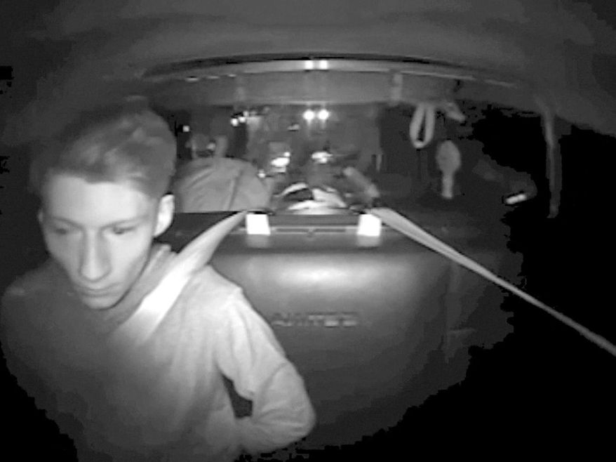 FILE - This July 30, 2016, file image made from a video provided by Washington State Patrol via The Daily Herald shows Allen Ivanov in the back of a patrol car in a police camera video shortly after his arrest on Interstate 5 in Lewis County, Wash. Ivanov, who shot and killed three people at a house party in July near Seattle, pleaded guilty Monday, Dec. 19, one day before a prosecutor was to announce his decision on whether to seek the death penalty. (Washington State Patrol via The Herald via AP, File)