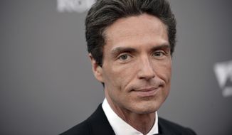 In this Sept. 30, 2013, file photo, Richard Marx arrives at the LA Philharmonic&#x27;s Walt Disney Hall 10th Anniversary Celebration at Walt Disney Concert Hall in Los Angeles. Marx wrote Tuesday, Dec. 20, 2016, that he is not a hero for apparently intervening after an unruly passenger had to be forcibly restrained on a Korean Air flight between Hanoi and Seoul. Marx and his wife, former MTV VJ Daisy Fuentes, documented efforts to restrain the passenger on social media, and Marx later wrote that they were home safe. (Photo by Richard Shotwell/Invision/AP, File)