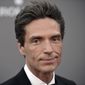 In this Sept. 30, 2013, file photo, Richard Marx arrives at the LA Philharmonic&#39;s Walt Disney Hall 10th Anniversary Celebration at Walt Disney Concert Hall in Los Angeles. Marx wrote Tuesday, Dec. 20, 2016, that he is not a hero for apparently intervening after an unruly passenger had to be forcibly restrained on a Korean Air flight between Hanoi and Seoul. Marx and his wife, former MTV VJ Daisy Fuentes, documented efforts to restrain the passenger on social media, and Marx later wrote that they were home safe. (Photo by Richard Shotwell/Invision/AP, File)