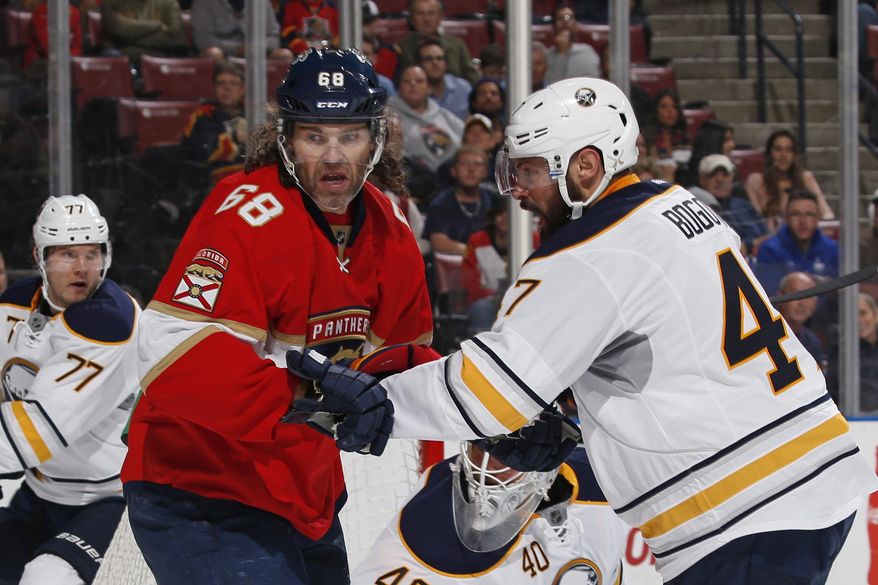 Buffalo Sabres defenseman Zach Bogosian (47) defends against Florida Panthers right wing Jaromir Jagr (68) at the side of the net during the first period of an NHL hockey game, Tuesday, Dec. 20, 2016, in Sunrise, Fla. (AP Photo/Joel Auerbach)