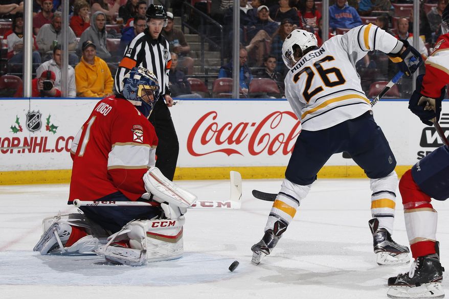 Florida Panthers goaltender Roberto Luongo (1) stops a shot by Buffalo Sabres left wing Matt Moulson (26) during the second period of an NHL hockey game, Tuesday, Dec. 20, 2016, in Sunrise, Fla. (AP Photo/Joel Auerbach)