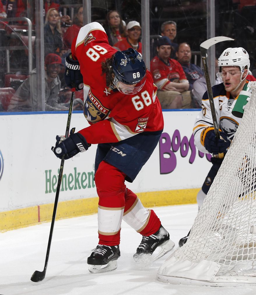 Buffalo Sabres center Jack Eichel (15) defends against Florida Panthers right wing Jaromir Jagr (68) during the first period of an NHL hockey game, Tuesday, Dec. 20, 2016, in Sunrise, Fla. (AP Photo/Joel Auerbach)