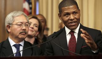 San Francisco Police Chief William Scott, right, speaks next to Mayor Ed Lee at a news conference in San Francisco, Tuesday, Dec. 20, 2016. San Francisco appointed Scott, a deputy chief of the Los Angeles Police Department, to head the city police department as it deals with a number of racially charged issues. (AP Photo/Jeff Chiu)