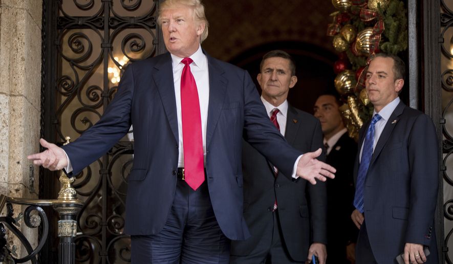 President-elect Donald Trump, left, accompanied by Trump Chief of Staff Reince Priebus, right, and Retired Gen. Michael Flynn, a senior adviser to Trump, center, speaks to members of the media at Mar-a-Lago, in Palm Beach, Fla., Wednesday, Dec. 21, 2016. (AP Photo/Andrew Harnik) **FILE**