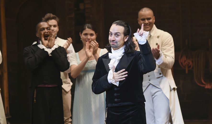 In this July 9, 2016 file photo, &quot;Hamilton&quot; creator Lin-Manuel Miranda, foreground, gestures during his final performance curtain call in New York.  Miranda, who was everywhere in popular culture this year, was named The Associated Press Entertainer of the Year, voted by members of the news cooperative. (Photo by Evan Agostini/Invision/AP, File)